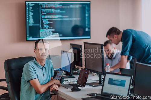 Image of Programmers engrossed in deep collaboration, diligently working together to solve complex problems and develop innovative mobile applications with seamless functionality.