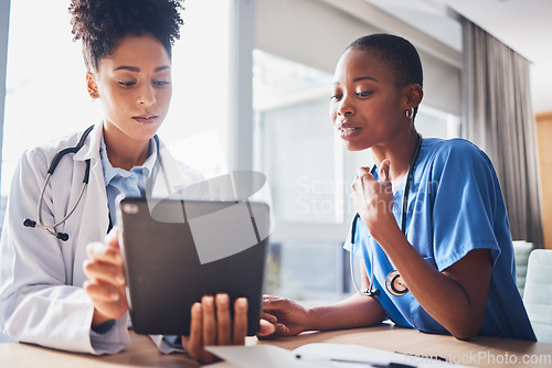 Image of Tablet, black people or nurses with medical research reading news or tests results in hospital together. Teamwork, digital tech or African doctors planning or speaking of healthcare report on website