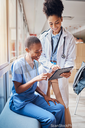 Image of Tablet, black women or doctors planning surgery in conversation about medical news or tests results in hospital. Teamwork, happy people or African nurses speaking of healthcare report or web research