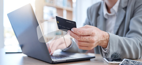 Image of Hands, laptop and credit card for ecommerce, online shopping or banking on the office desk. Hand of business person or shopper typing on computer for internet purchase, bank app or transaction