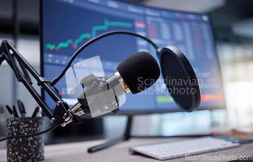 Image of Microphone, studio and computer screen for podcast, radio or audio news on stock market update background. Mic, sound technology and pc monitor for broadcast, trading review and algorithm statistics