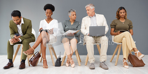 Image of HR, technology and business people waiting in line for an interview during recruitment. Hiring, resume or cv with a man and woman employee sitting in a human resources candidate line for opportunity