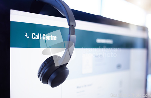 Image of Headset, computer or screen in call center, customer service or contact us office for help, support or b2b lead generation. Zoom, headphones or telemarketing equipment on consulting technology in crm