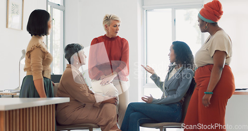 Image of Business women, diversity and conversation with collaboration and business meeting with team in workplace. Business people, talking and listening with teamwork, communication and team building