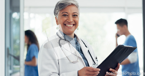 Image of Face of a doctor in hospital management success, healthcare vision and cardiology trust with checklist for insurance documents. Happy medical Indian woman with paperwork for clinic schedule or agenda