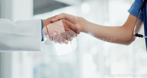 Image of Handshake, doctor and nurse with teamwork, partnership and thank you for healthcare service, meeting and hospital onboarding. Medical worker team or employees shaking hands for clinic welcome