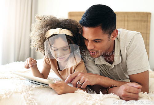 Image of Tablet, learning child and father teaching for online development, home education and relax on bed. Dad or black man with girl on digital technology for internet game, helping and bonding together