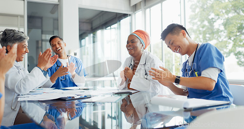 Image of Doctors, nurses and meeting with documents in hospital discussing medical records. Teamwork, planning and group of healthcare professionals, men and women with paperwork talking in training workshop.