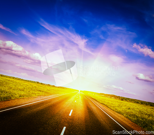 Image of Road in blooming spring meadow