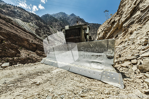 Image of Bulldozer doing road construction in Himalayas