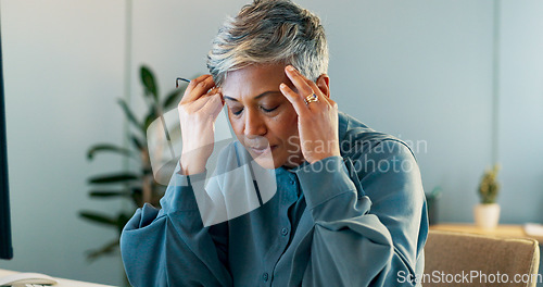 Image of Stress, headache and burnout with a business woman suffering from anxiety while working in her office. Compliance, mental health and migraine with a senior female employee feel frustrated at work