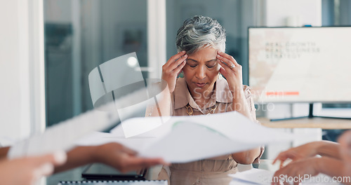 Image of Headache, meeting and business woman stress, pain or anxiety, thinking of documents review. Burnout, fatigue or frustrated senior boss or manager in busy office with chaos of paperwork and team hands