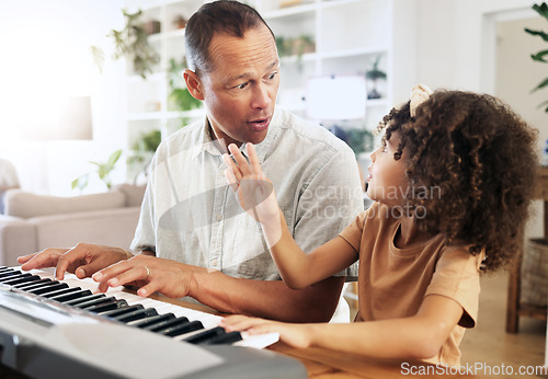 Image of Piano, learning and girl with grandfather in home, playing or bonding together. Wow surprise, education and shocked grandpa teaching kid how to play musical instrument, acoustic and electric keyboard