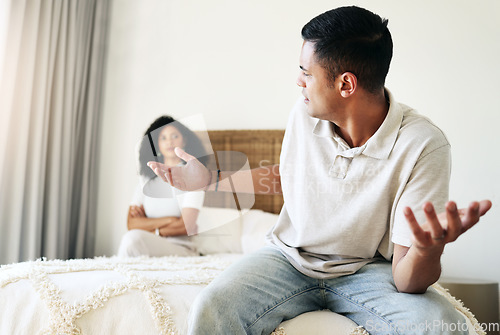 Image of Argument, stress and couple in bedroom for conflict, breakup conversation and communication. Sad, angry and man speaking to a woman about relationship, divorce and frustrated with problem in marriage