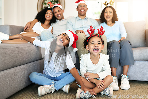 Image of Christmas, smile and portrait of big family on sofa in home living room, bonding and laughing at funny joke. Love, xmas holiday and care of happy children, parents and grandparents sitting on couch.