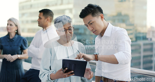 Image of Business people diversity, tablet or office balcony in digital marketing research, strategy planning or calendar management. Mature ceo, talking manager or internship training schedule on technology