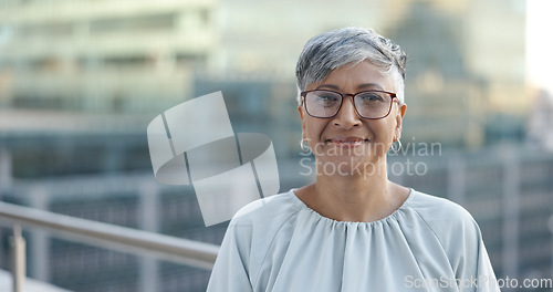 Image of Senior corporate woman, face and rooftop in city with smile, happy and success by New York skyline. Executive manager, happiness and vision in metro with buildings, sunshine and goals in accounting