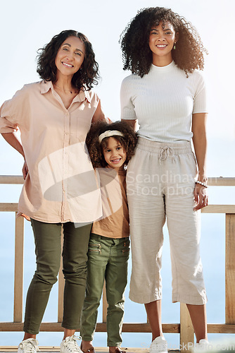 Image of Portrait, black family or children with a senior woman, mother and daughter standing outdoor together on a balcony or veranda. Mothers day, love or kids with a girl, parent and grandparent outside