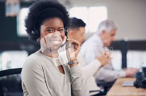 Image of Portrait, call center and contact us with a black woman consultant working in her telesales office. Customer service, support and telemarketing with a female employee consulting using a headset