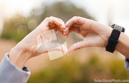 Image of Heart hands, outdoor and fitness health for cardiology exercise, running or wellness closeup. Like, workout and healthy person with love sign and smart watch in park or nature for care emoji