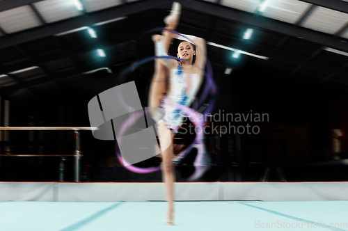 Image of Portrait, ribbon and motion blur with a black woman gymnast in a studio for dance training or exercise. Fitness, art and gymnastics with a female dancer in a gymnasium for rhythmic routine practice