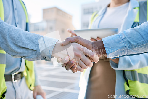 Image of Handshake, engineering and meeting with people and solar panels for partnership, renewable energy or deal. Agreement, sustainability and thank you with engineer shaking hands for eco, b2b or welcome