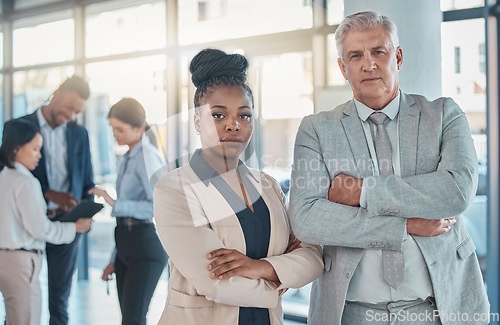 Image of Serious, business people and portrait with arms crossed in leadership meeting, collaboration or teamwork at office. Confident corporate executive leaders standing in company management at workplace