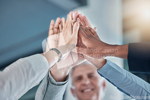 Image of Business people, hands and high five in unity, partnership or collaboration for teamwork, agreement or trust at office. Group of employee workers touching hand together for team support or success