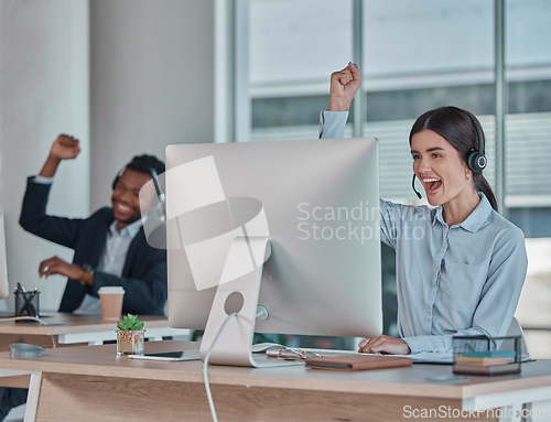 Image of Business woman, call center and team celebration for winning, promotion or sale in telemarketing at office desk. Happy female consultant celebrating victory, good news or success at the workplace