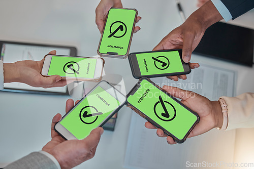 Image of Business people, hands and phone with tick in networking, teamwork planning or sharing information. Hand of group above showing smartphone display in completion for tasks, mobile app or data syncing