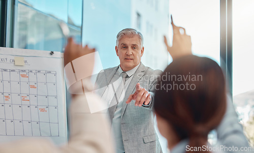 Image of Senior businessman, coaching and question in team presentation for collaboration or engagement at office. Elderly male CEO leader or coach training staff with hands raised in FAQ, teamwork or meeting