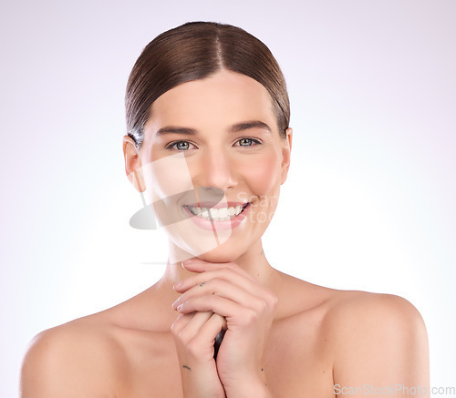 Image of Portrait, skincare and face relax on hands of woman in studio for grooming, cosmetics or wellness on gradient background. Beauty, happy and girl model smile for in luxury, makeup and skin dermatology