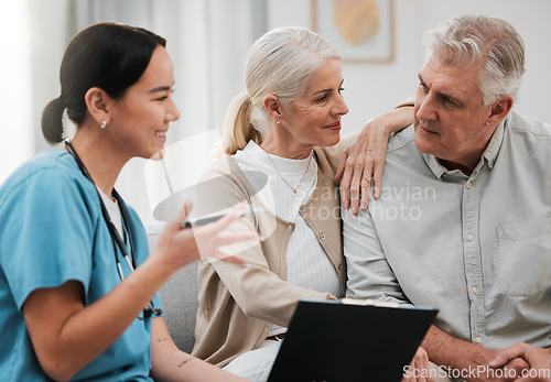 Image of Nurse, healthcare and documents with a senior couple in their home, talking to a medicine professional. Medical, insurance or life cover with a mature man and woman meeting a medicine professional