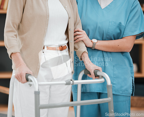 Image of Nurse or senior hands on walking frame for support, help or trust moving legs in rehabilitation. Physiotherapy healthcare, elderly nursing or medical caregiver consulting disabled patient