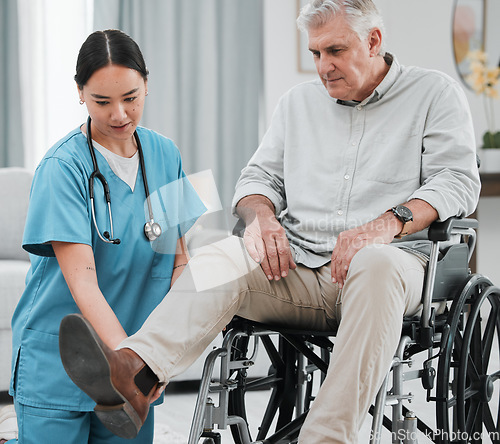 Image of Wheelchair help, nursing home and man with injury or disability with nurse support. Wellness, healthcare and retirement of a elderly person with foot pain from a medical problem with caregiver