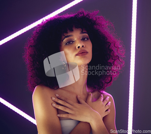 Image of Purple light, beauty and portrait of a woman in studio with neon uv for makeup, cosmetics and self love. Face of aesthetic gen z model black person on gray background for natural art glow and fashion