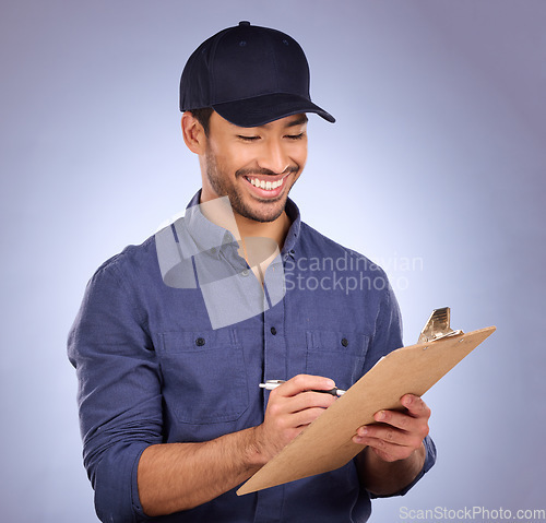 Image of Man, studio and writing on clipboard working on delivery, shipping and logistics with hat and smile. Happy asian model person or worker on checklist, list or form for information on purple background