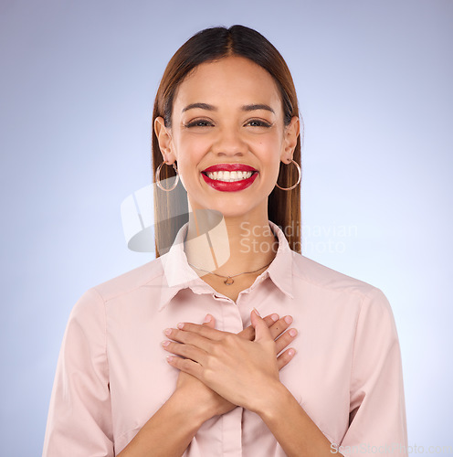 Image of Hands on chest, heart and healthcare, woman against studio background and content, healthy and cardiology. Wellness, portrait and gratitude, cardiovascular health with female, happy with self love