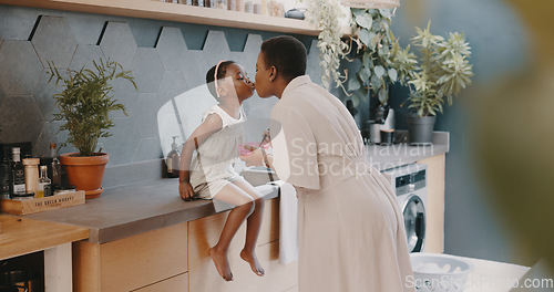 Image of Family, children and love with a girl and mother playing together in the kitchen of their home. Kids, funny and tickline with a black woman and daughter laughing while bonding in their house