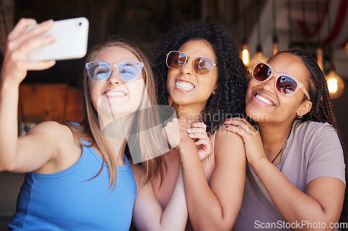 Image of Sunglasses, friends and selfie with women in restaurant for social media, freedom and support. Happy, diversity and photo with group of girls in cafe for picture, networking and relax on weekend