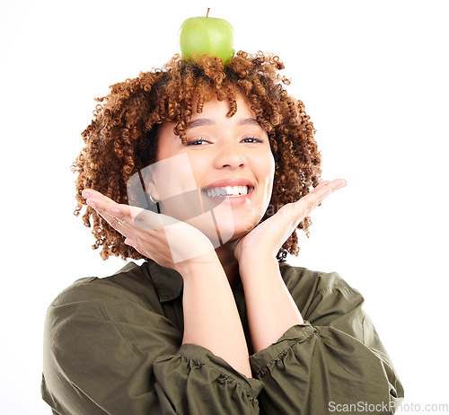 Image of Woman, apple and head balance portrait with fruit product for weight loss diet, healthcare lifestyle or body detox. Vegan food, nutritionist studio and happy African girl isolated on white background