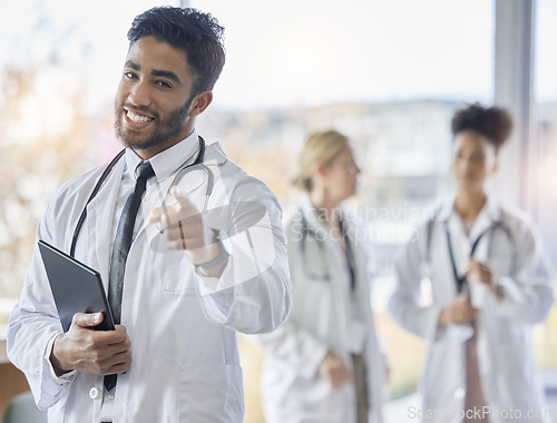 Image of Indian doctor, portrait and healthcare worker pointing at you for we are hiring. Medical staff, hospital employee and happy smile of a young intern ready for working in clinic recruitment on tablet