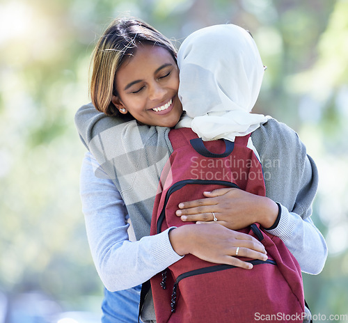 Image of Happy muslim students, park or hug with backpack in garden or school campus bonding, friends acceptance or community support. Smile, Islamic or women in embrace, fashion hijab or university college