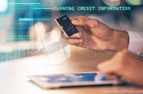 Image of Hands, tablet and credit card hacking bank information, cloning or cybersecurity at night on office desk. Hand of hacker stealing banking data, app or identity in fraud or online theft at workplace