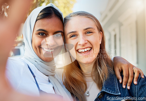 Image of Selfie, friends and women, hug and outdoor with freedom, carefree and cheerful together in town. Portrait of Muslim girls with joy, smile and ladies embrace, happiness and reunion on summer break