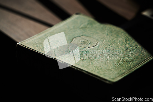 Image of Education, learning and book on a table for law studying or knowledge for university studying. Library, scholarship or desk in a college with literature in a vintage cover for legal research