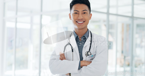 Image of Asian man, face and doctor smile for healthcare, vision or career ambition and advice at the hospital. Portrait of happy and confident Japanese medical expert smiling, phd or medicare at the clinic