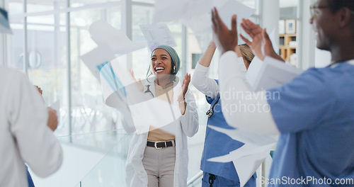Image of Doctors, success or celebration and throwing papers in life insurance diversity, medicine goals or healthcare target. Smile, happy or excited people or nurses in clapping, cheering or winner gesture