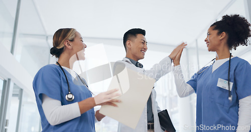 Image of Doctors, success or celebration and throwing papers in life insurance diversity, medicine goals or healthcare target. Smile, happy or excited people or nurses in clapping, cheering or winner gesture