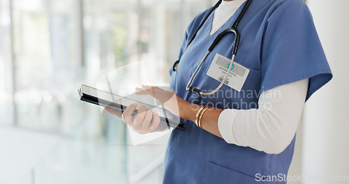 Image of Digital tablet, research and woman doctor analyzing results from a health test in hospital. Technology, touchscreen and female healthcare worker researching medical treatment or medication in clinic.